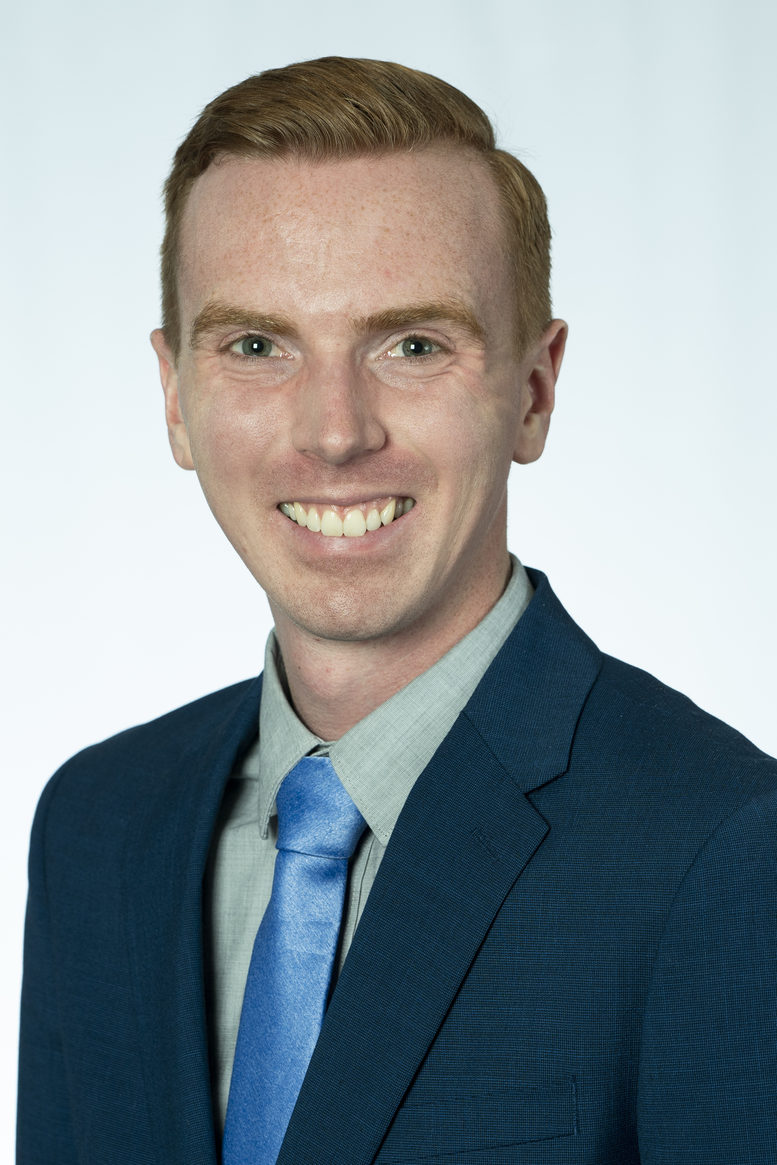 Chris Kotschevar man in blue suit and blue tie